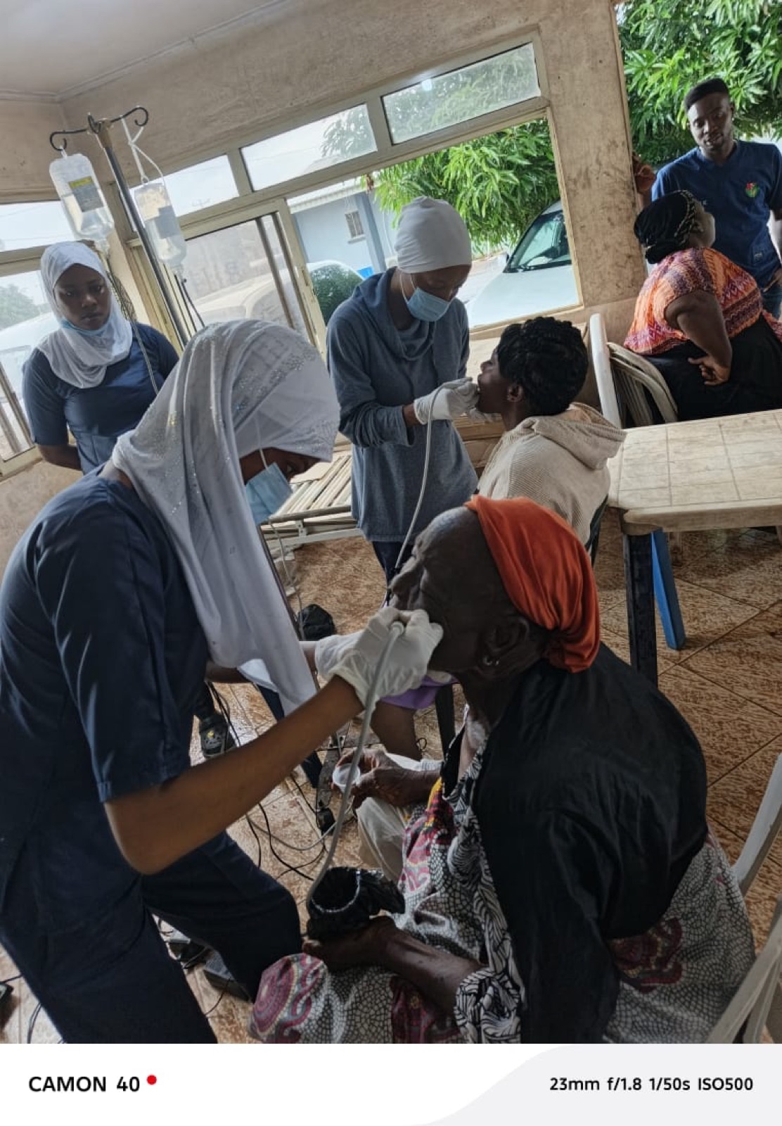 A volunteer performing an eye examination at the Agbowa-Ikosi mission, 2026