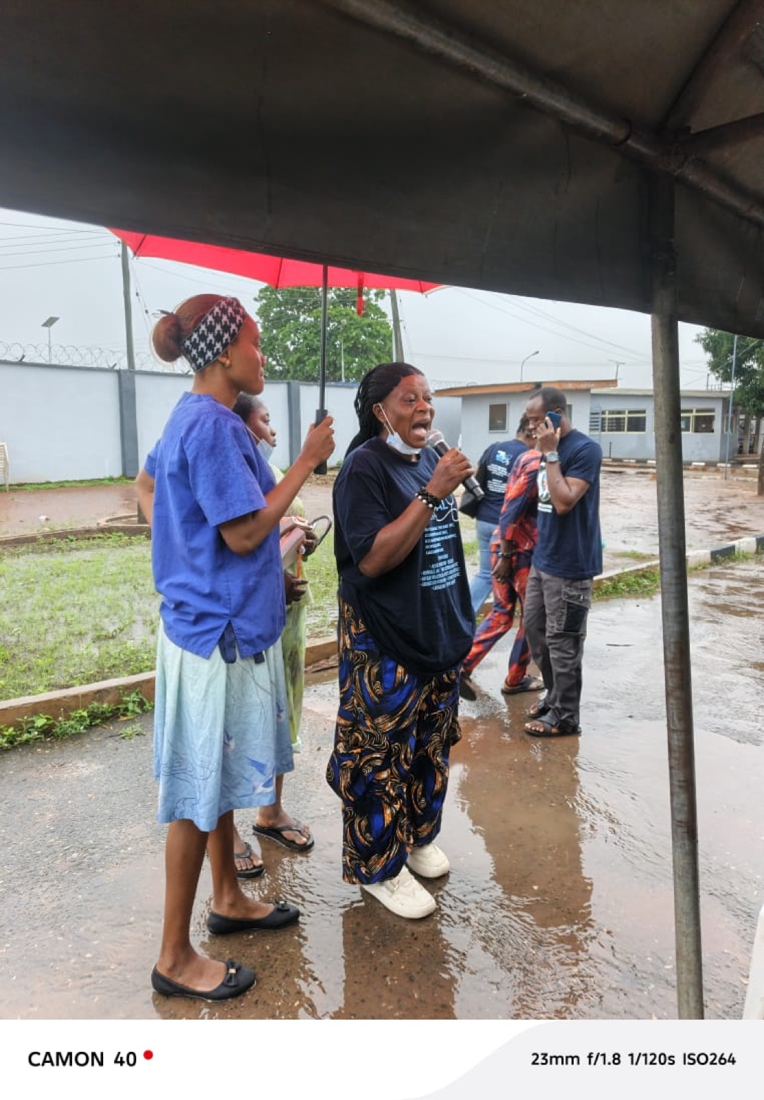 A KBB volunteer delivering community wellness education at the Agbowa-Ikosi free medical mission, 2026