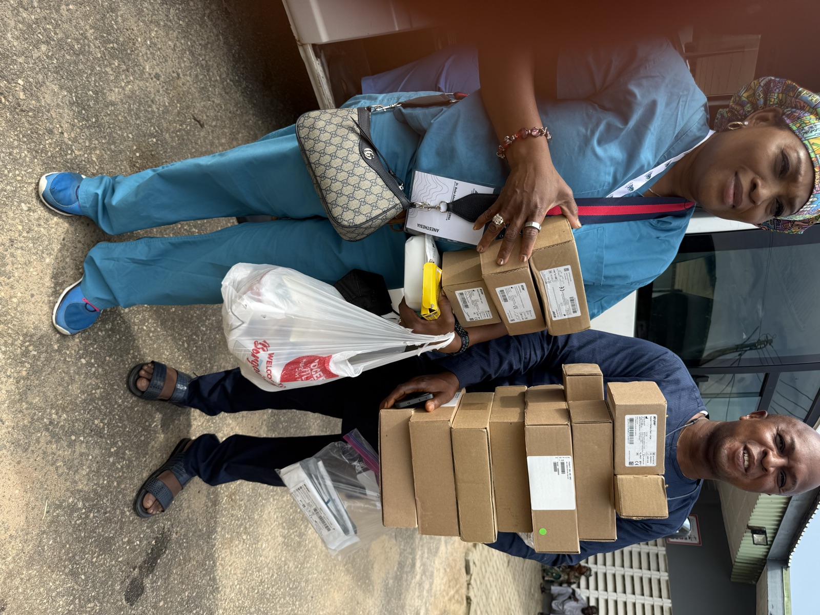 KBB volunteers transporting boxes of donated medical supplies for the 2026 mission