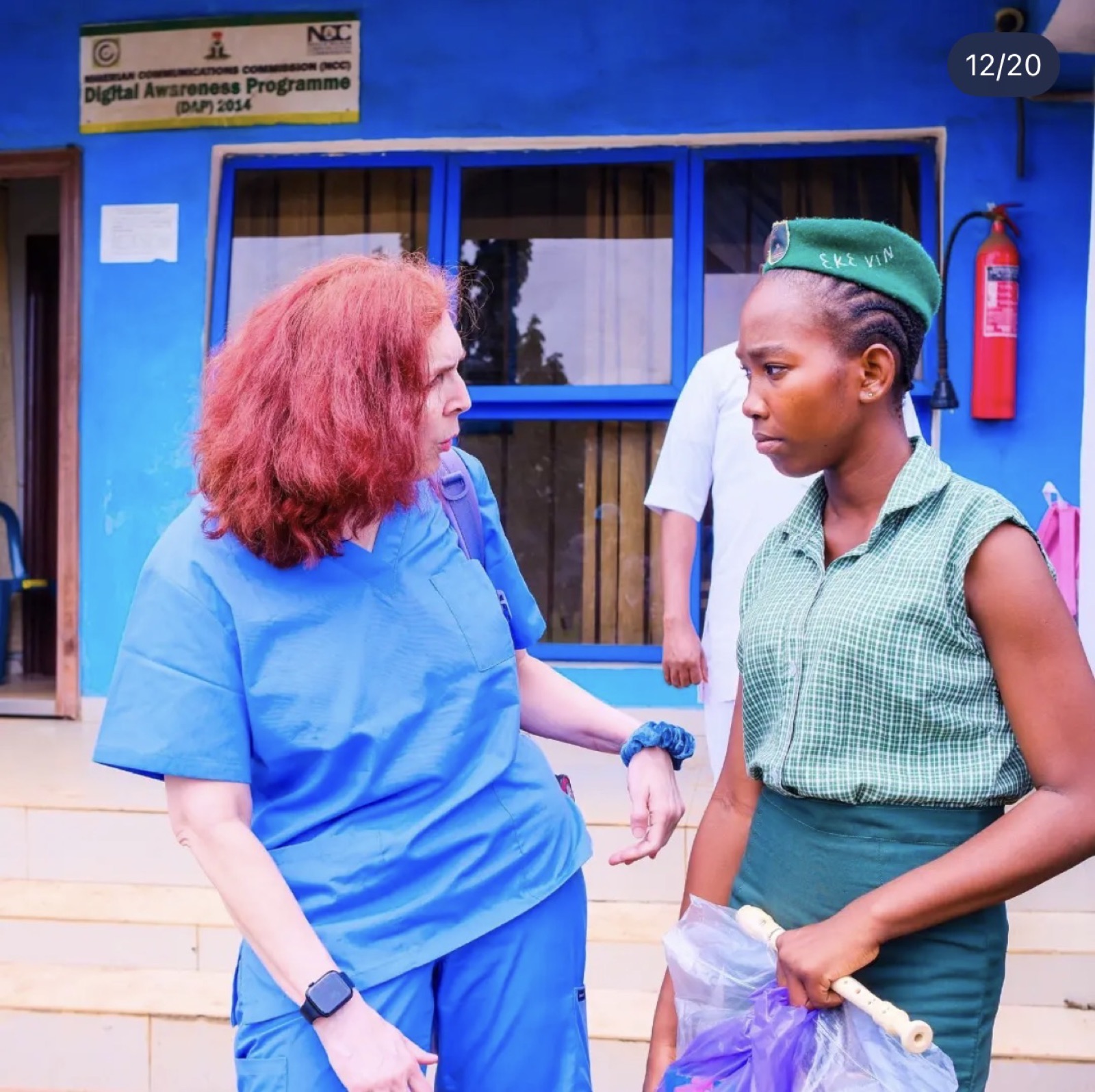 A KBB volunteer speaking with a student at the girls' outreach in Sagamu, 2026